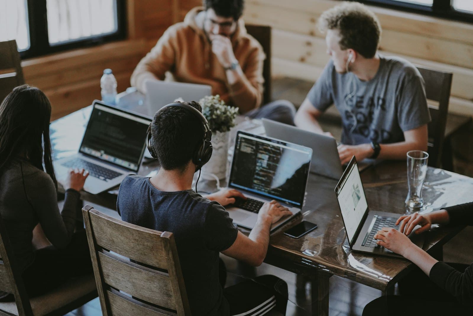 A team building software together around one table